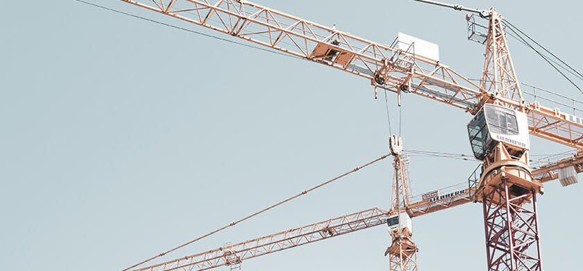 orange crane that uses wire from a wire company